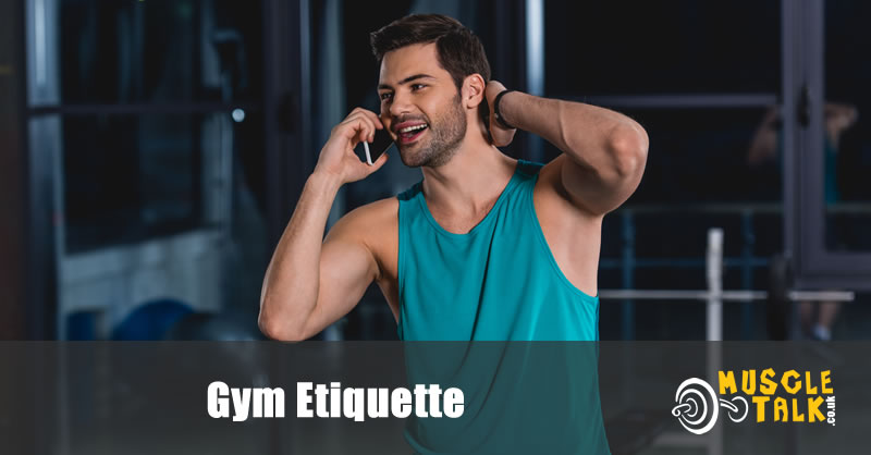 Man talking on phone in gym