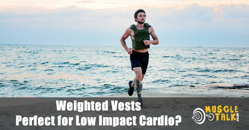 Man jogging on the beach wearing a weighted vest