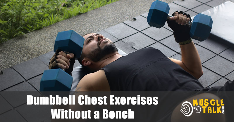 man doing chest press with dumbbells on the floor