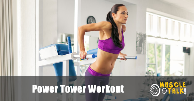 woman using a power tower in the gym